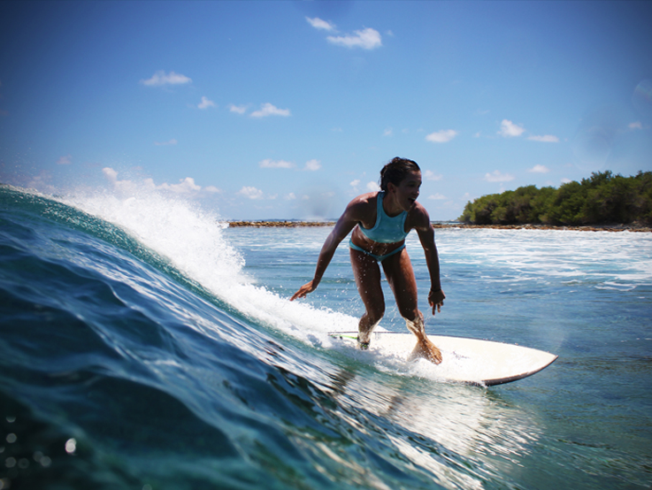 Kokoh Bikini's founder Kendal surfing