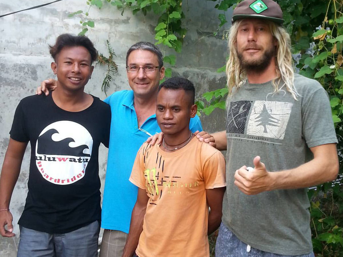 PCU: PM Curtis Lowe (far right) and supporter Daniel Cassise with locals